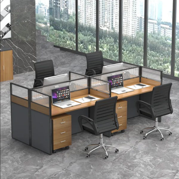 Modern 4-way office desk system with glass partitions, drawers for storage, and integrated grommets for cable management.