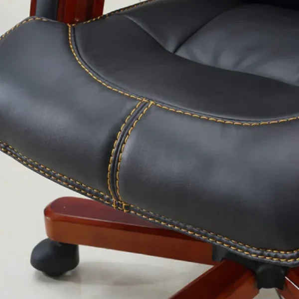 Genuine black leather executive reclining office chair with walnut arms and ergonomic padding.