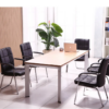Black PU leather visitor chair with chrome frame and padded armrests for comfortable guest seating in office environments.