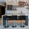 Black Modern Leather Bar Stool with faux leather upholstery and a natural iron frame, perfect for counter-height seating.