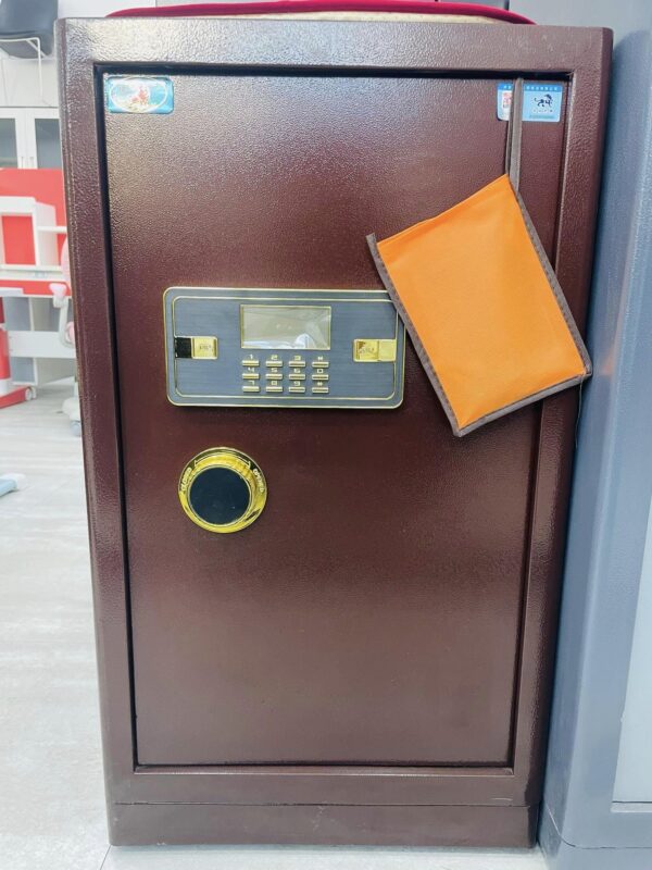 Digital Safe Box with Dual Authentication placed in a modern office setting, showcasing its sleek design and durable build.