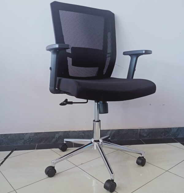 Ergonomic office chair with mesh backrest, adjustable arms, and chrome base for comfort and mobility.