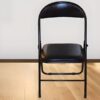Foldable leather study chair with padded seat and back, ergonomic design, and foldable frame for easy storage.