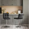 Black Modern Leather Bar Stool with faux leather upholstery and a natural iron frame, perfect for counter-height seating.