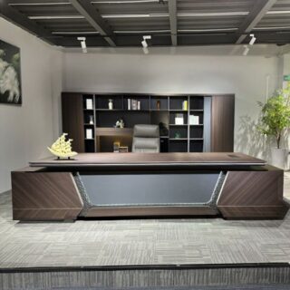 Elegant L-shaped executive desk with industrial stitching design, spacious workspace, and sturdy metal frame.