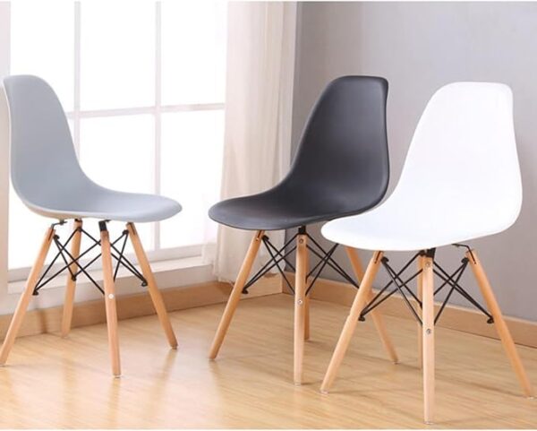 Colorful Plastic Eames Style Chairs with wooden legs in green, pink, blue, orange, and black, perfect for dining or office use.