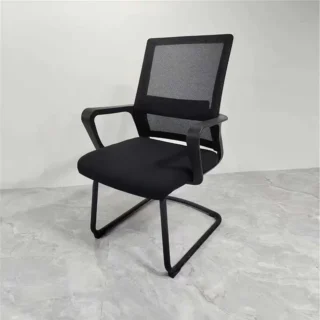 Ergonomic office visitor chair with a black mesh backrest, padded cushion seat, and sled base, ideal for modern offices and homes.