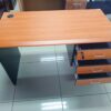 1400mm Cherry Office Desk with three drawers and built-in grommet for cable management, providing a spacious and organized workspace.