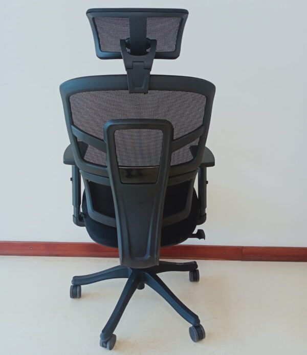 Ergonomic mesh office chair with adjustable backrest, headrest, and lumbar support.