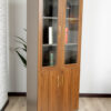 Filing Cabinet 2 Door Bookcase with a wood grain finish, glass doors, and lockable bottom storage.
