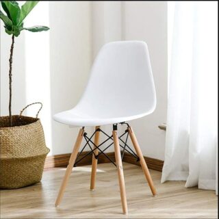 A stylish Plastic Eames Side Chair featuring a molded ergonomic seat, natural beechwood legs, and black metal braces for stability.