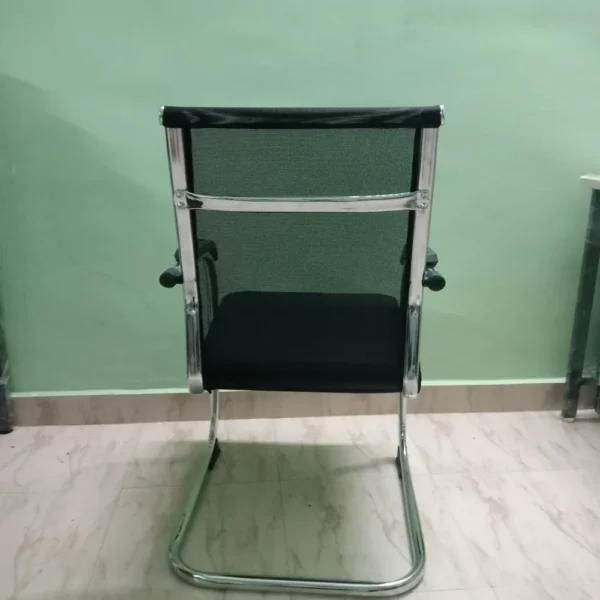 Mild Steel Visitor Office Chair with mesh back, cushioned seat, and chrome cantilever frame for office use.